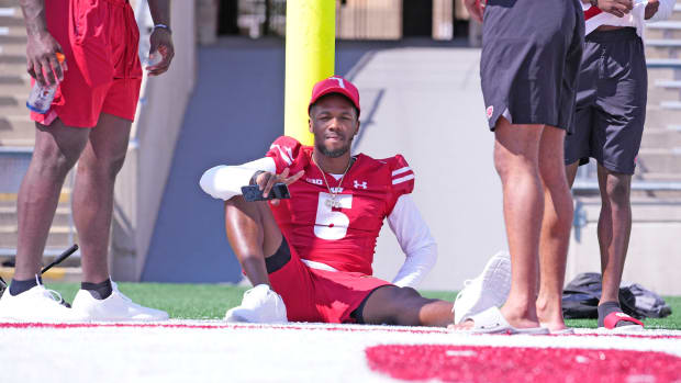 Wisconsin cornerback Cedrick Dort leaning up against the goal post during local football media day (Credit: Mike De Sisti / Milwaukee Journal Sentinel / USA TODAY NETWORK)